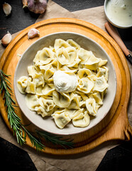 Dumplings with sour cream and rosemary.