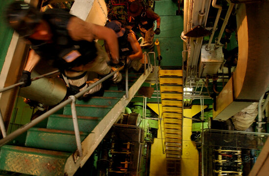 US Navy Sailors Searching Ship