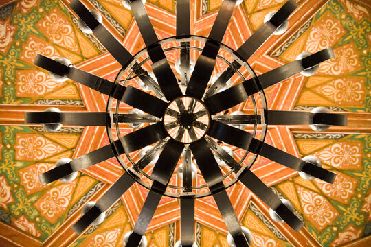 Detail of an ornate ceiling and chandelier in the old Riviera del Pacifico in Ensenada, Baja California, Mexico.