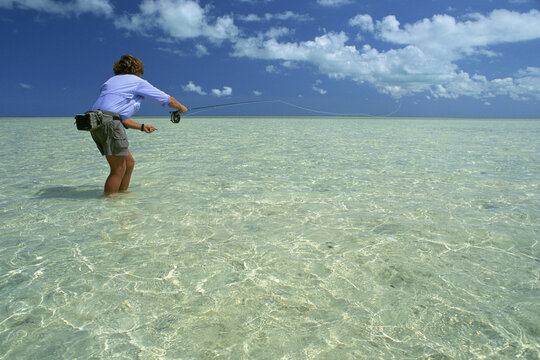 A fly-fisherman casts to his quarryin the Bahamas.
