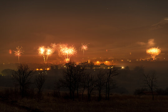 Small village and fireworks. New Year.