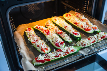 before baked zucchini with ham and vegetables, under cheese