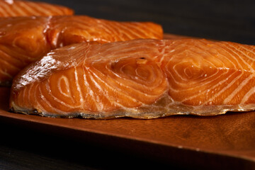 Smoked salmon on wooden board