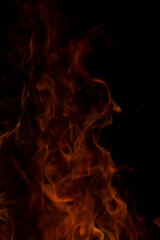 Fototapeta premium fire flames with sparks on a black background.