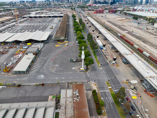 Aerial view of a freeway construction site on both sides of a busy road in West Melbourne