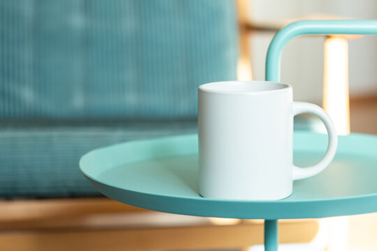 White mug on the table.