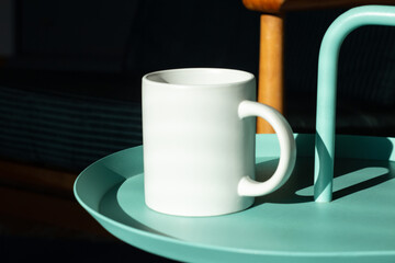 White mug on the table.