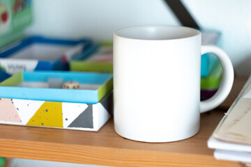 White mug on shelf in play room