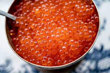 Bowl full of red caviar. Close view.