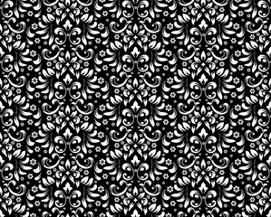 Wallpaper in the style of Baroque. Seamless vector background. White and black floral ornament. Graphic pattern for fabric, wallpaper, packaging. Ornate Damask flower ornament