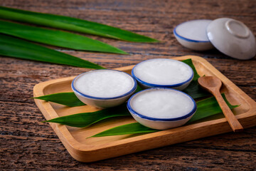 Coconut milk custard in small porcelain cup (Kanom Tuay), Thai dessert.