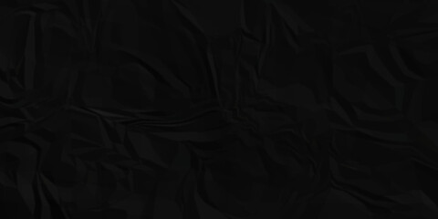 Dark Black facbric paper backdrop crumpled texture. dark black textured crumpled black paper background. panorama black paper texture background, crumpled pattern.