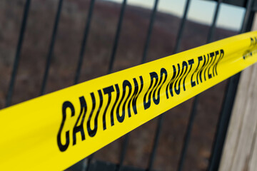 Caution tape close up during winter season