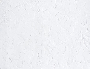 White abstract textured wall background. Light wallpaper background, textured putty, plaster. Copy space for the design.