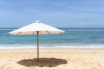Sandy beach with umbrella on sandy beach