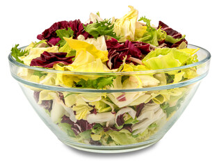Mixed salad leaves lettuce, frisee, lamb's lettuce and radicchio in glass bowl, cut out on...