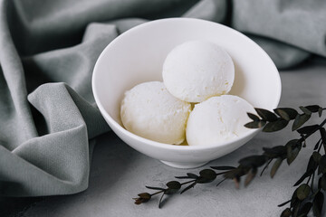 Vanilla ice cream scoops in a bowl
