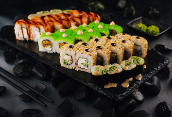 different types of sushi rolls on a plate