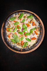 pizza on a plate on black background