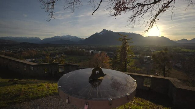 Mountain view from monchsberg hill from pointer or compass at sunset in sunny winter weather, Salzburg, Austria. Josefsturm. Bertoldsturm, Stadttor. Bertolds Zwinger. Mittelalter. Directional signpost