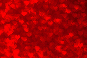 Abstract background of red blurred hearts, bokeh on Valentine's Day
