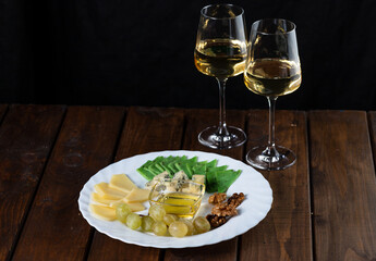 Cheese plate and wine glasses