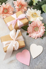 Valentine's Day background with gifts, beautiful flowers and hearts. Valentine's day, Womans day, wedding, birthday or mothers day greeting card.