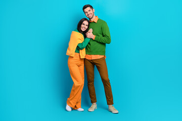 Full size photo of loving idyllic people cuddle comfy true love concept isolated over blue color background