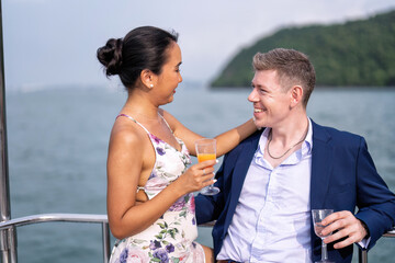 Romantic couple in love have fun sailing in the sea standing on yacht deck enjoy amazing view