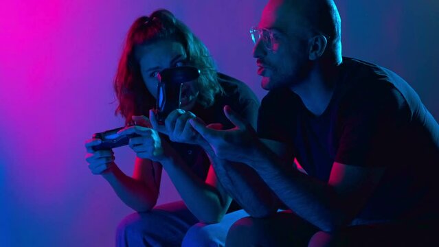 Gamers playing PS4 at home