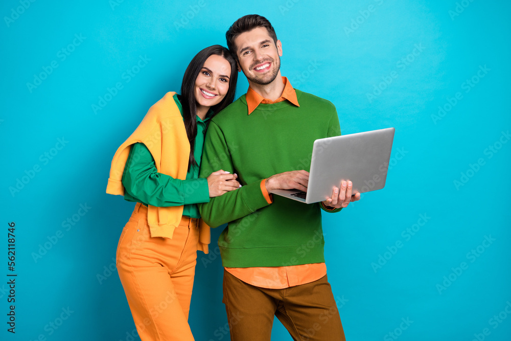 Poster photo of positive couple using digital netbook search web buy purchase for valentine day isolated on