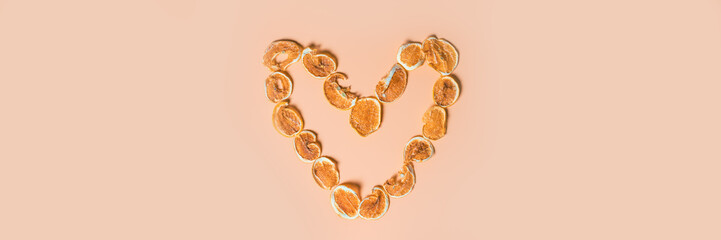 Dried lemon slices laid out in the form of heart. Healthy nutrition and diet for weight loss. Healthy food. Banner