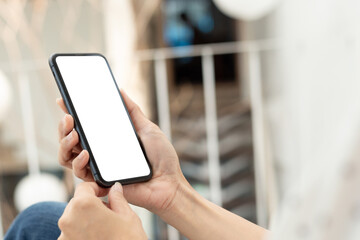 cell phone blank white screen mockup.hand holding texting using mobile on desk at office.background empty space for advertise.work people contact marketing business,technology