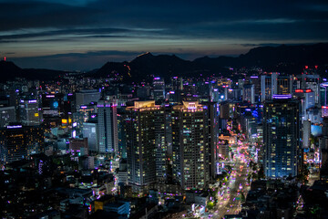 Shooting a tower view of Megapolis with skyscrapers under the night sky. Nightscape of Seoul City, the capital of Korea. High-resolution photo source