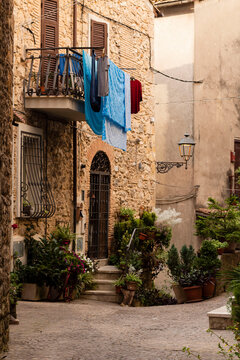 View of old narrow street in  Italy. Architecture of small town. Cozy
