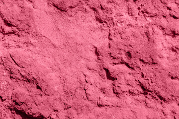 Viva Magenta. Color of the year 2023. Toned Photo of natural concrete old wall texture. Cement surface. Horizontal. Abstract empty background.