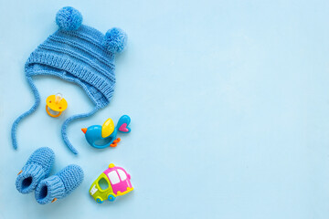 Baby boy blue hat with booties and accessories, top view