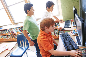 Children, education or kids in classroom with computer for learning, research or website search....