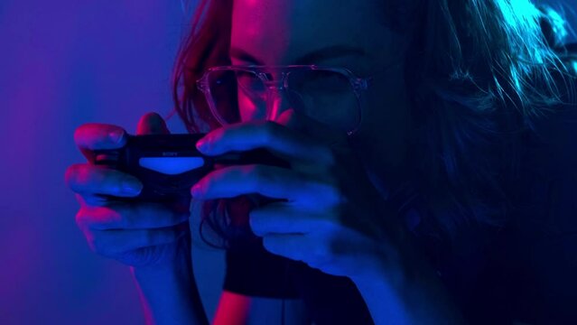 A beautiful professional gamer girl and her team take part in a cyber gaming cyber tournament.