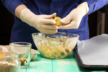 Cooking oatmeal cookies with nuts and candied fruit sweet nutritious dessert