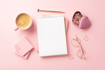 8-march concept. Top view photo of notepad stylish pen glasses heart shaped clips sticky note paper and cup of frothy coffee on isolated pastel pink background with copyspace