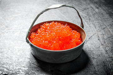 Red caviar in the bowl.