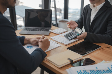 Businessman and Certified Public Accountant (CPA) auditor providing accounting and auditing services in the same company and stock market chart data and anti bribery of accounting