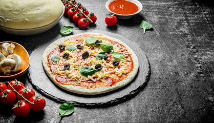 Preparation pizza. Dough with various ingredients for cooking pizza.