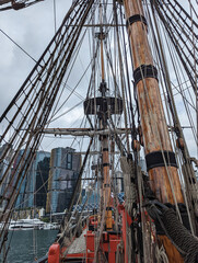 A closeup view of the mast and rigging on the Endeavour Replica moored in Darling Harbour, Sydney, New South Wales, Australia.