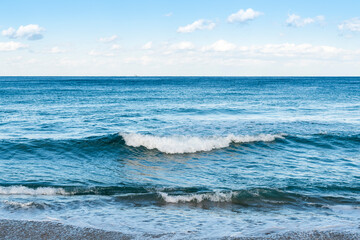 The water ripples in the sea against the backdrop of a cloudy blue sky. The color of the blue sky is heartbreaking. Emotionally disturbing colors High resolution photo editing source images