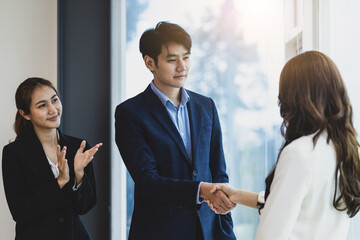 Handshake, Business partners meeting discussing cooperation agreements on business projects. Collaboration of people in the organization.