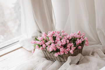 Beautiful pink flowers in bedroom, space for text. Romantic interior