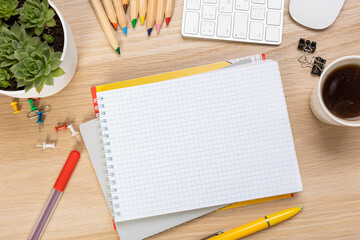 Notebook mockup with school stationery on a wooden table. back to school concept. Blank notepad with copy space. list of goals and plans for new year 2023