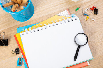 Notebook mockup with school stationery on a wooden table. back to school concept. Blank notepad with copy space. list of goals and plans for new year 2023